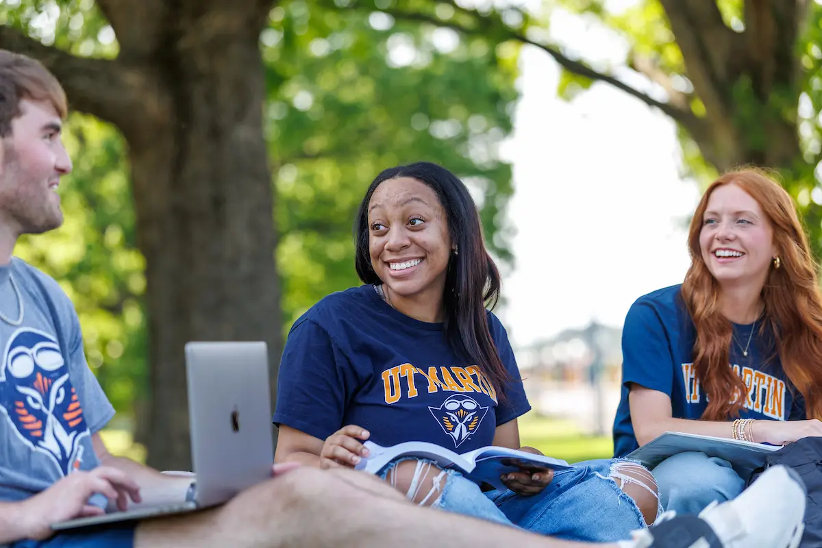Students outside talking and enjoying the quad.