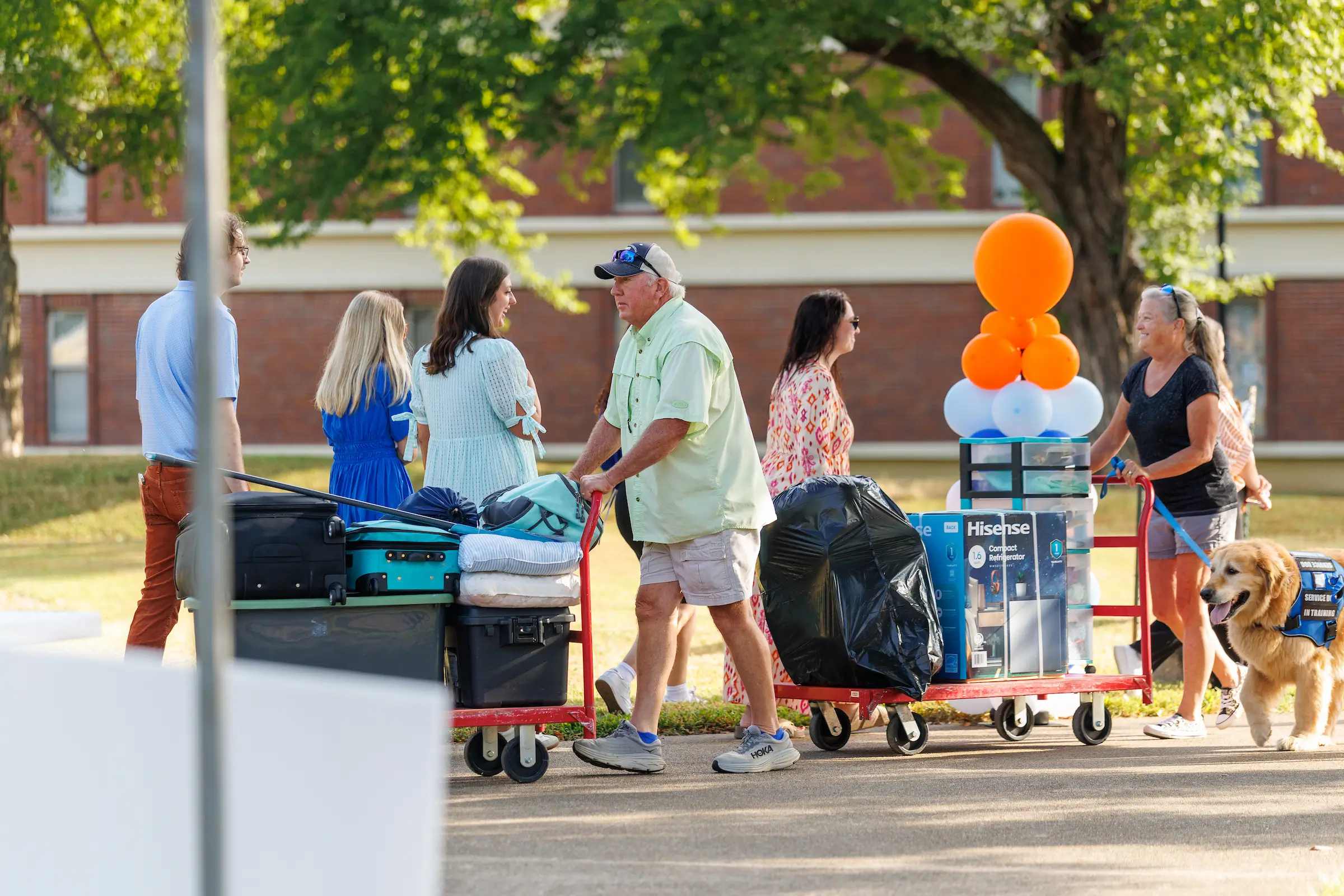 Families lend a hand during move-in.