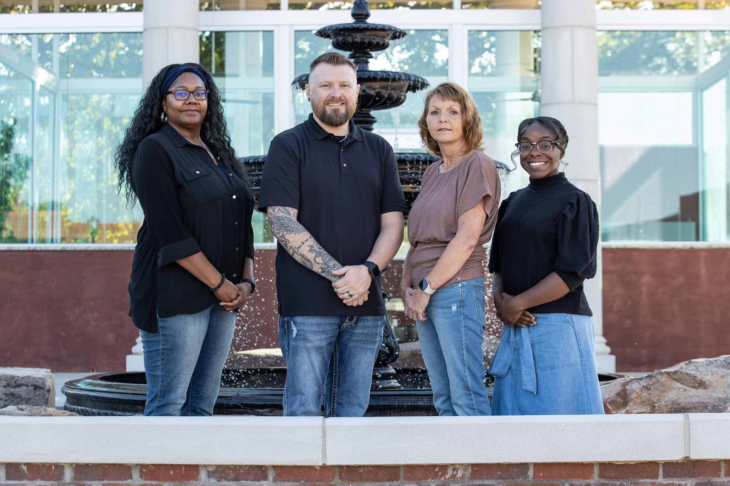 Student Health Staff members standing in front of the Oracle Fountain